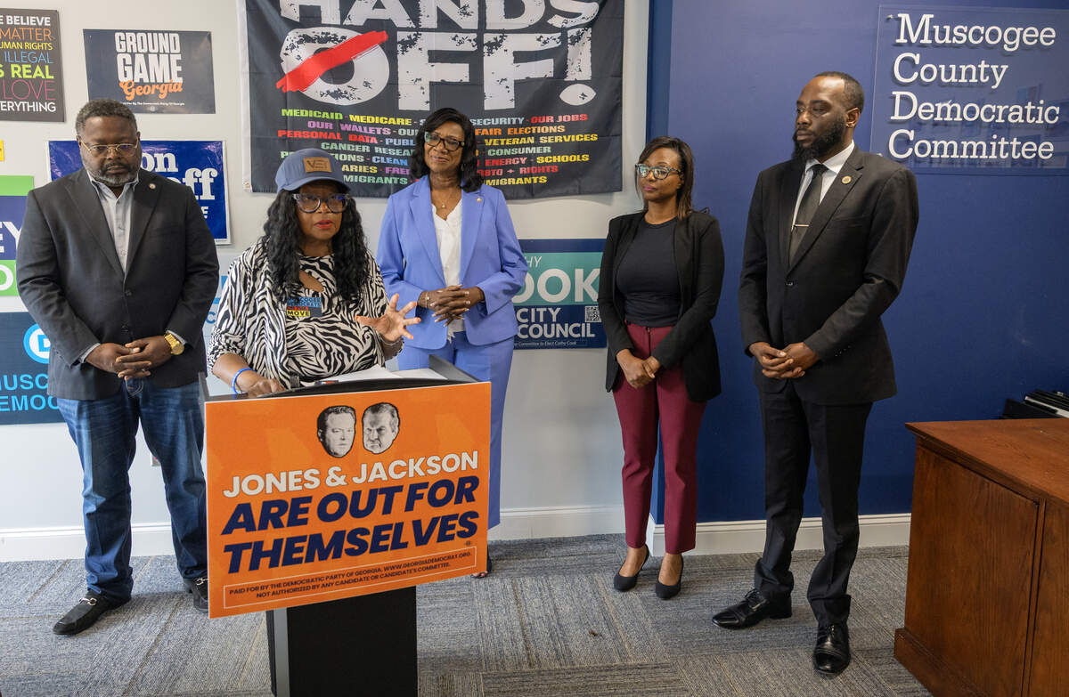 Community activist Gloria Tyson, at podium, speaks during a news conference June 8, 2026, in Columbus, starting the Georgia Democrats’ “Out for Themselves Tour,” criticizing the Republican gubernatorial runoff election candidates, Lt. Gov. Burt Jones and healthcare executive Rick Jackson. Also speaking at the event were, from left, state Rep. Teddy Reese (D-Columbus), Georgia House of Representatives minority leader and state Rep. Carolyn Hugley (D-Columbus), Columbus Councilor Simi Barnes of District 1 and Marquese Averett, a candidate for Georgia House District 140.