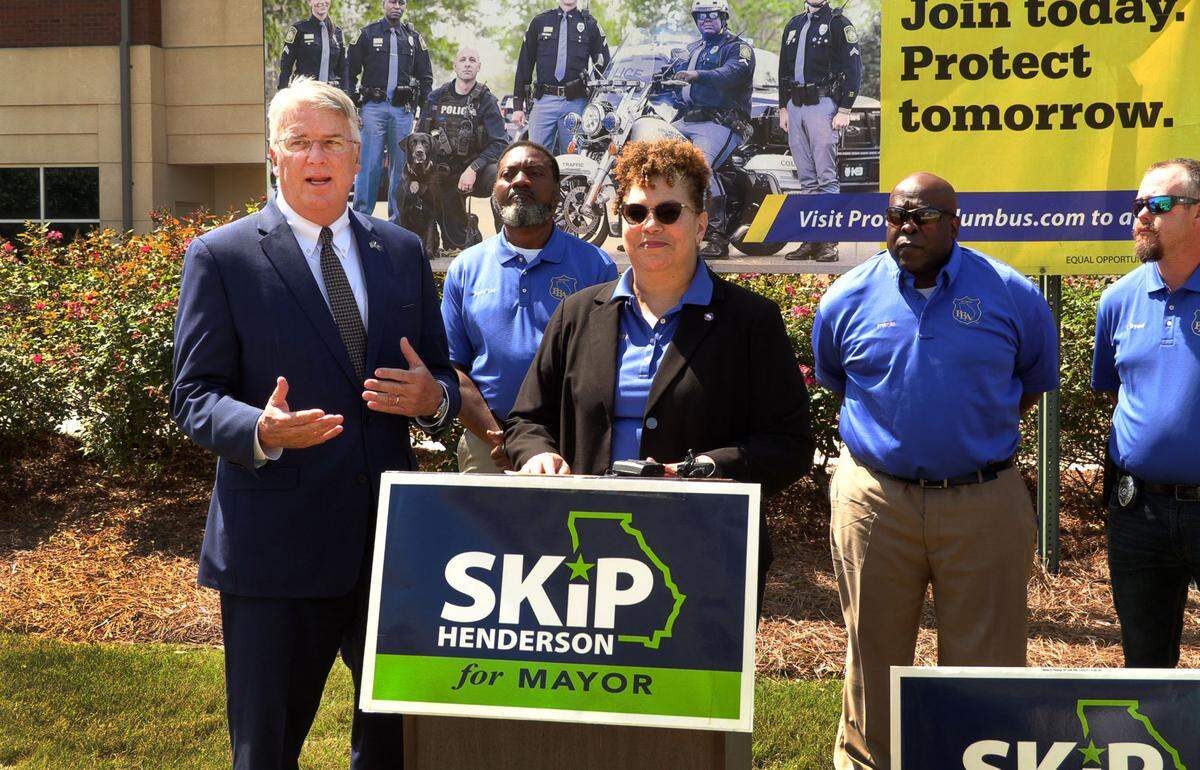 Columbus Mayor Skip Henderson, left, speaks after Antoinette Holloway, president of the West Georgia Chapter of the Police Benevolent Association, center, announced their endorsement of Henderson in the 2022 campaign for mayor of Columbus. 05/11/2022