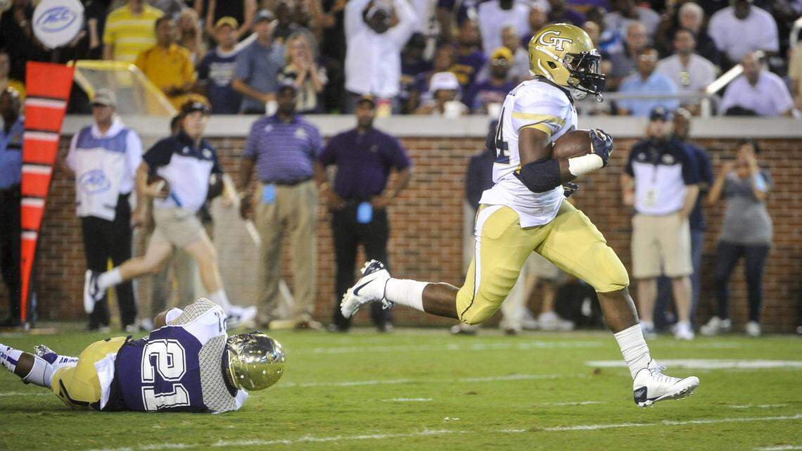 Georgia Tech running back Marcus Marshall (34) gets away from Alcorn State defensive back Quinton Cantue (21) as he runs for a touchdown during the first quarter of an NCAA college football game, Thursday, Sept. 3, 2015, in Atlanta. (AP Photo/John Amis)