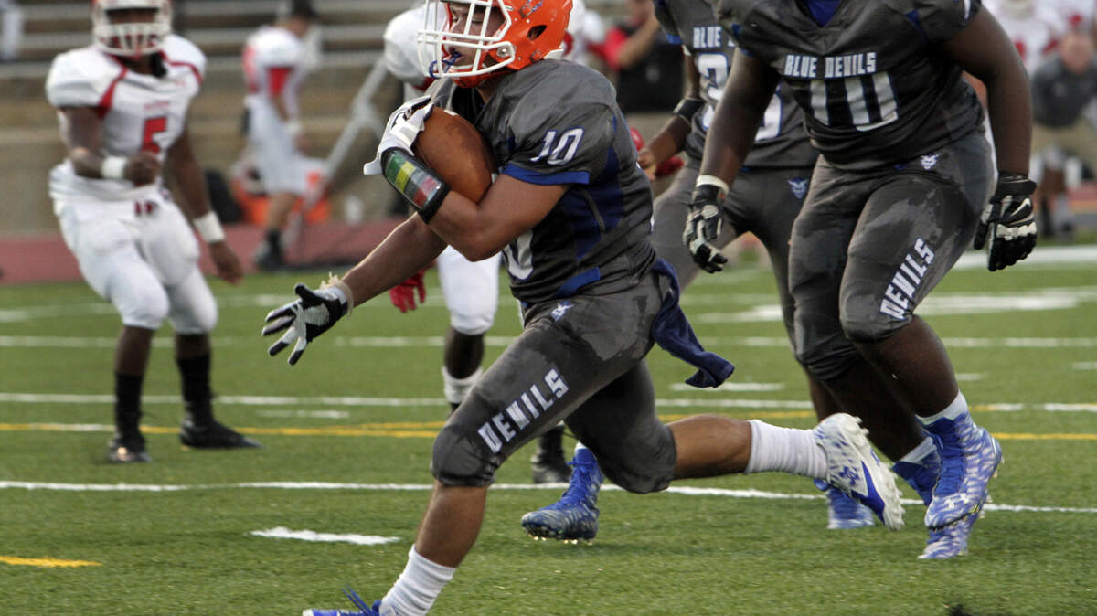 ROBIN TRIMARCHI rtrimarchi@ledger-enquirer.comColumbus High running back Ty Lucas breaks through the line to score against Marion County in first half play at Kinnett Stadium Thursday.  09.17.15