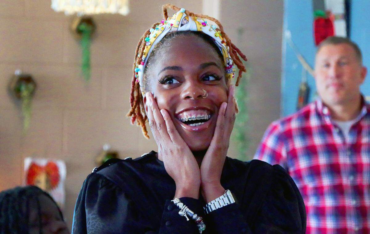 Eretha Hamilton, a sixth-grade science teacher at Double Churches Middle School, reacts after being surprised with the news Tuesday morning that she has been selected as one of three finalists for the Muscogee County School District 2025 Teacher of the Year award. 04/08/2025