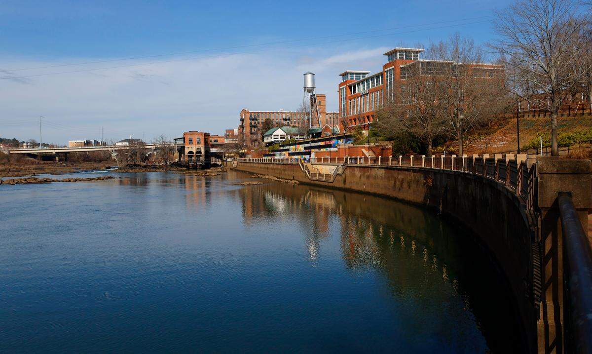 This view looks north along the Chattahoochee River as it flows alongside the Riverwalk in Columbus, Georgia.