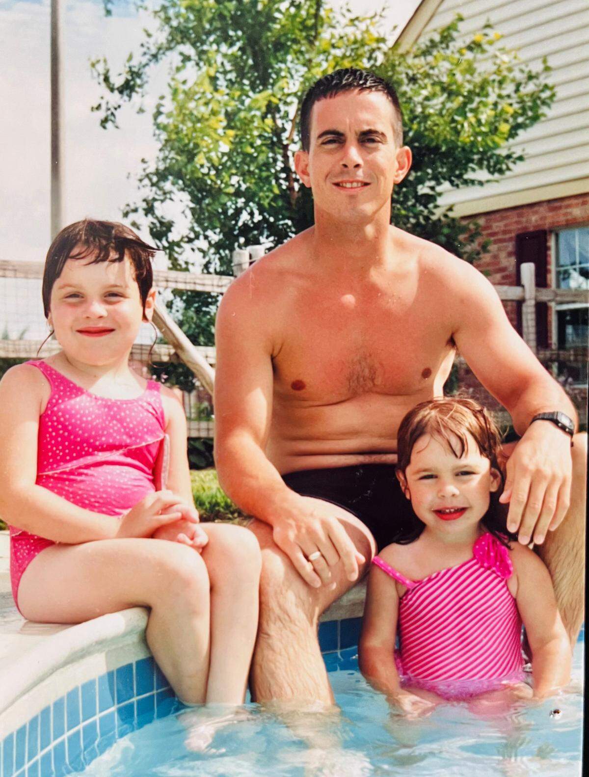U.S. Army 1st Sgt. Glenn Harris, who was among the soldiers who survived the 1993 Battle of Mogadishu in Somalia. He is seen here with his daughters, Tara and Heather.