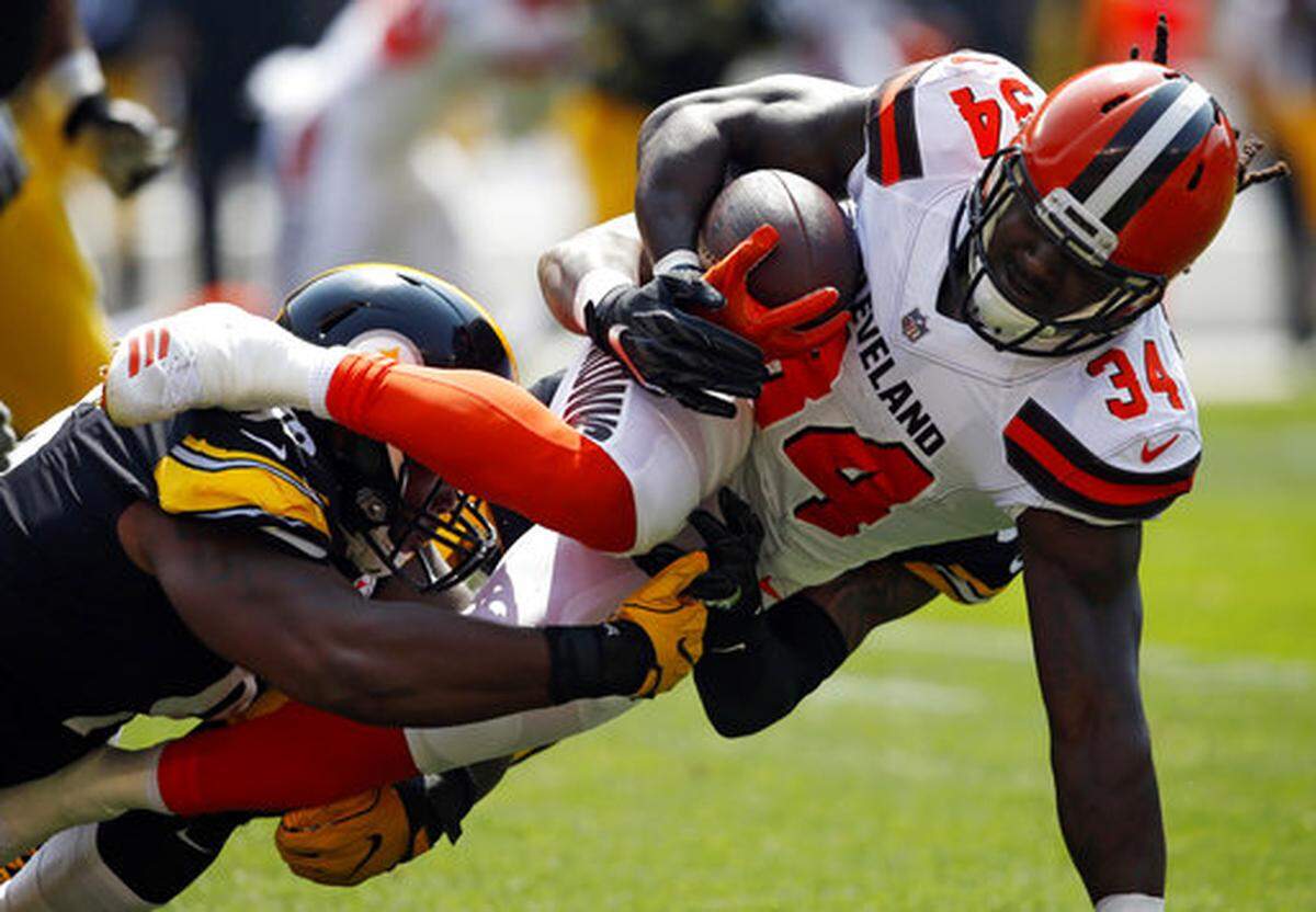 Pittsburgh Steelers defensive end L.T. Walton, left, tackles Cleveland Browns running back Isaiah Crowell (34) during the first half of an NFL football game, Sunday, Sept. 10, 2017, in Cleveland.