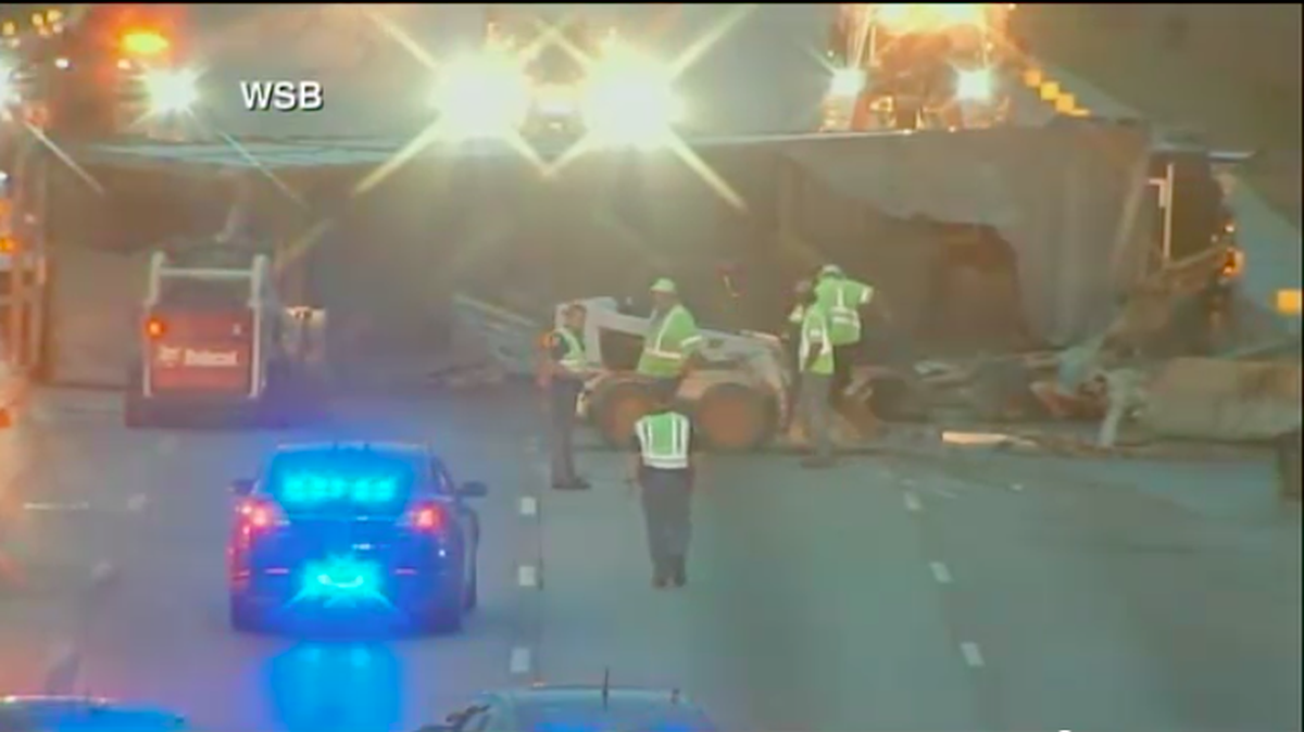 An overturned cattle truck sent cows wandering onto the lanes of I-75 South in Cobb County, shutting down the road and causing a massive backup of early-morning commuter traffic.