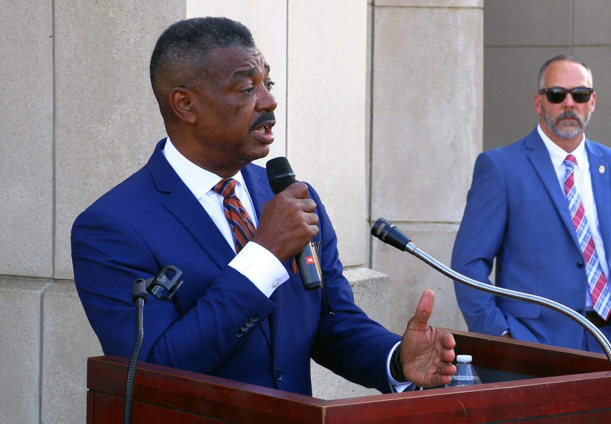 Columbus City Manager Isaiah Hugley, left, speaks during a Tuesday afternoon press conference about Columbus Animal Care & Control as Deputy Chief Lance Deaton of the Columbus Police Department looks on.