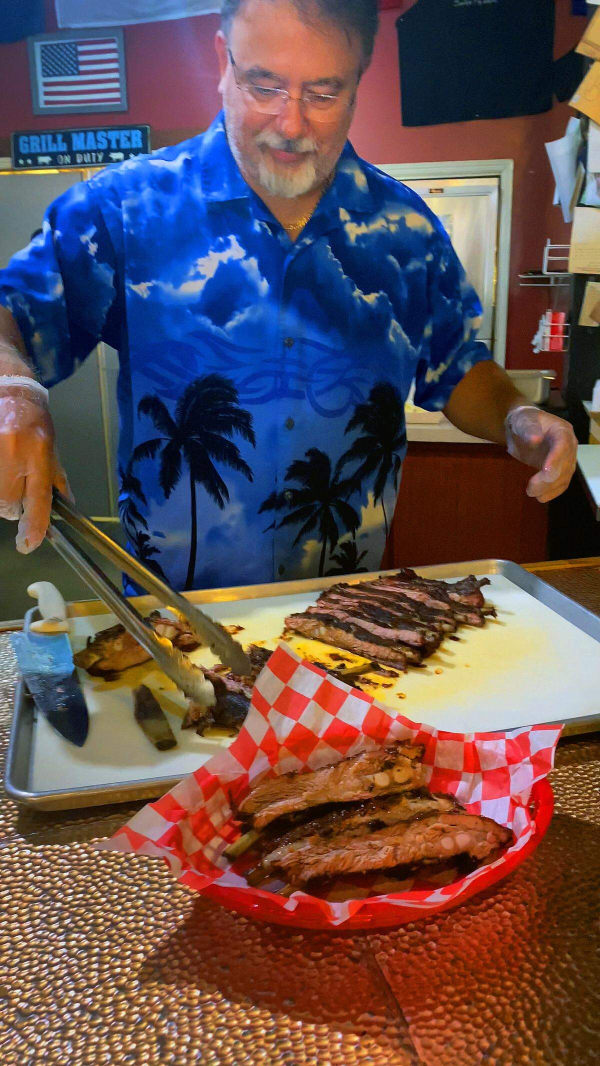 Zombie Pig BBQ owner David DeSteno prepares a serving of ribs during Columbus Restaurant Week. 07/24/2023