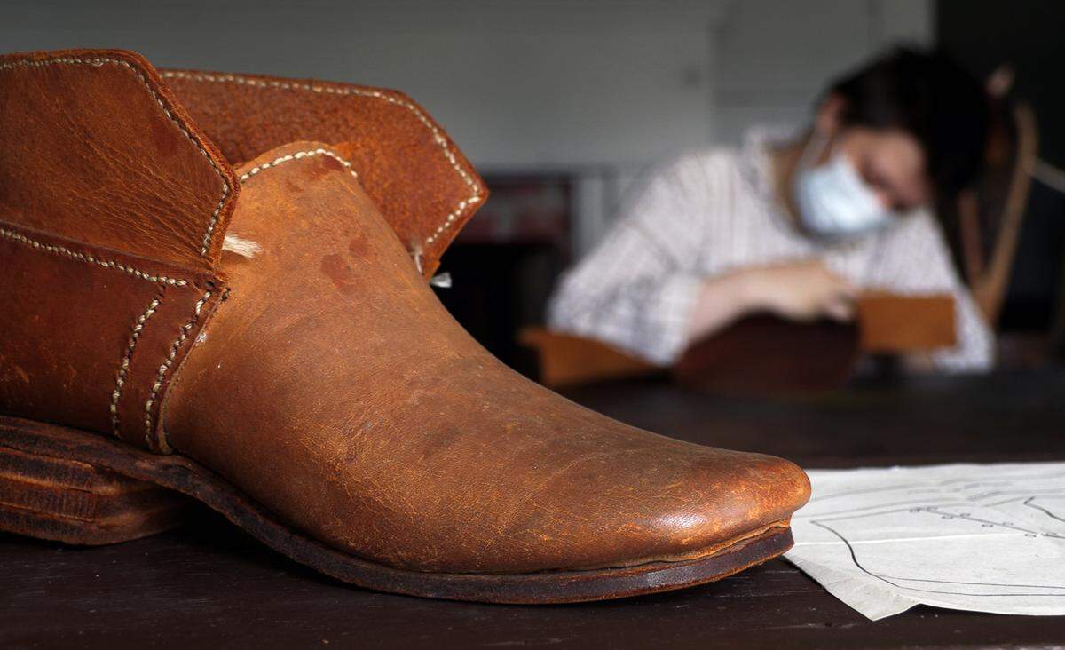 Connie Gresham, an interpreter at Historic Westville in Columbus, Georgia, demonstrates shoemaking recently. 09/02/2021