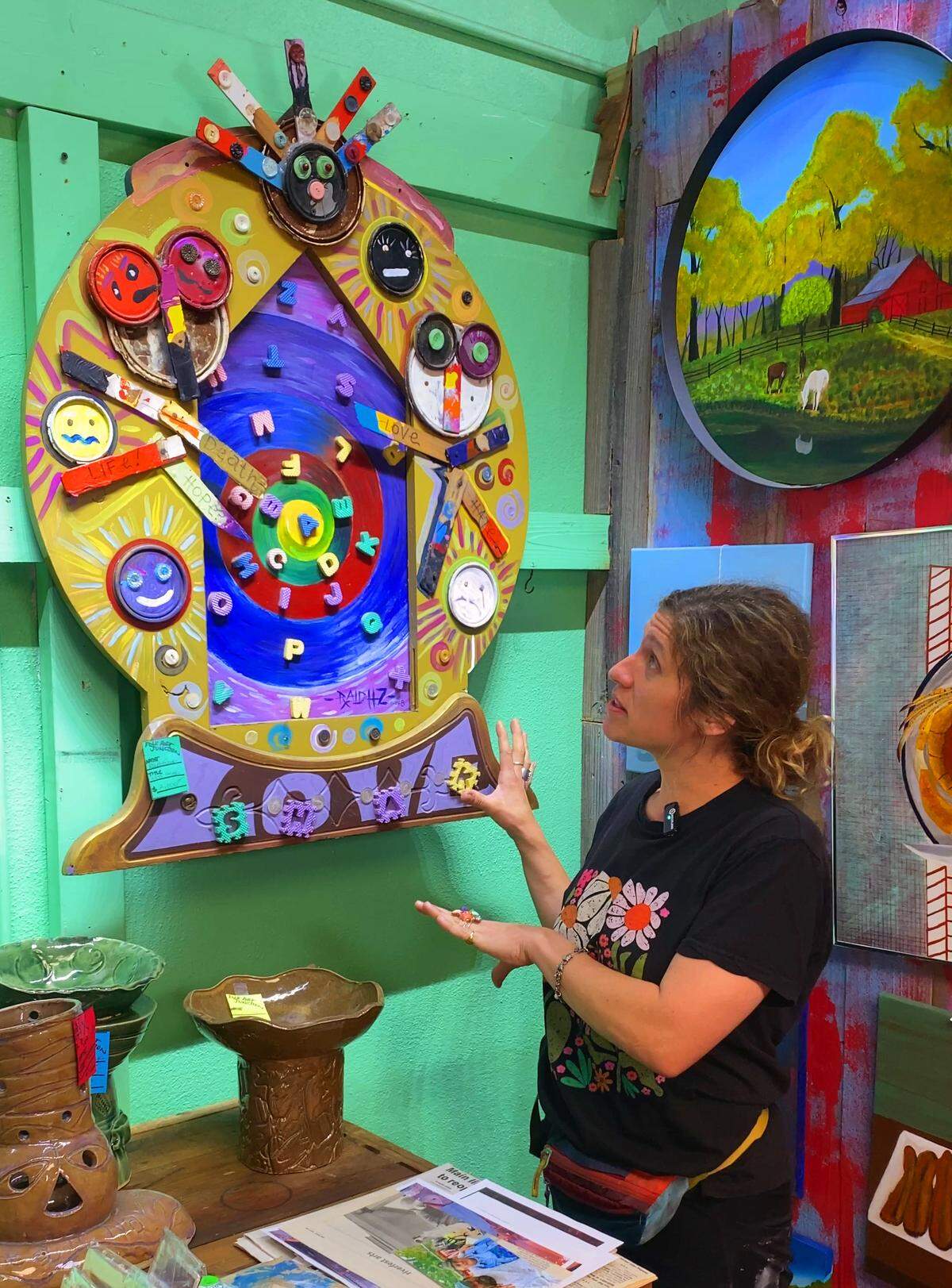 Folk artist Kaitlynn Etheridge, organizer of the Crossroads Folk Art Festival and director of the Columbus Collectives Museum, talks April 22, 2026, about the upcoming festival and some of the participating artists, including Ralph Frank, whose work is pictured here.