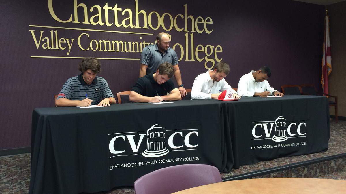 KEVIN PRICE/kprice@ledger-enquirer.comFour CVCC baseball players signed Thursday with Division I schools. From left, Chase Adkins, Georgia; JT Thomas, Mercer; Logan Haner, Western Kentucky; and Jordan Lee, Georgia State. Standing is CVCC coach Adam Thomas.