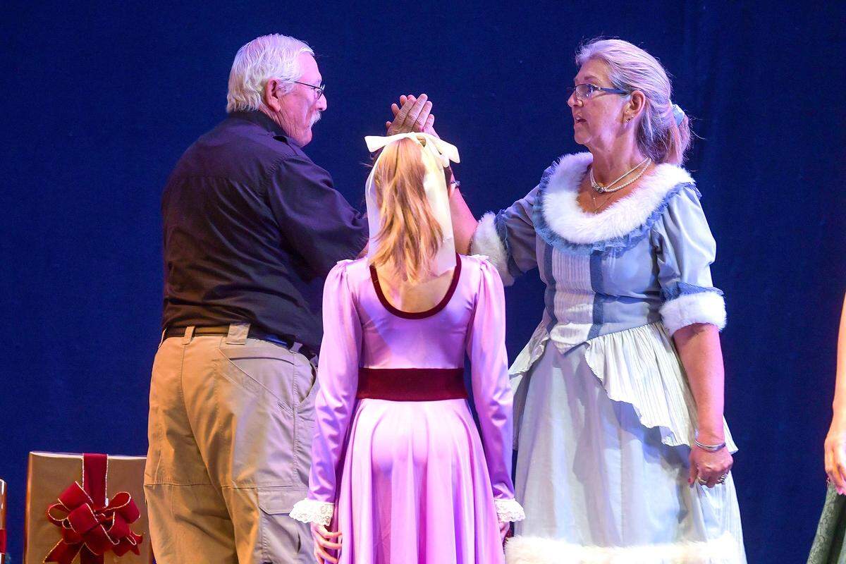 Harris County Sheriff Mike Jolley and his wife, Cindy, practice dancing on stage at the RiverCenter for the Performing Arts in Columbus during rehearsal Dec. 12, 2023, for their roles in the Columbus Ballet’s production of “The Nutcracker” Dec. 16 and 17.
