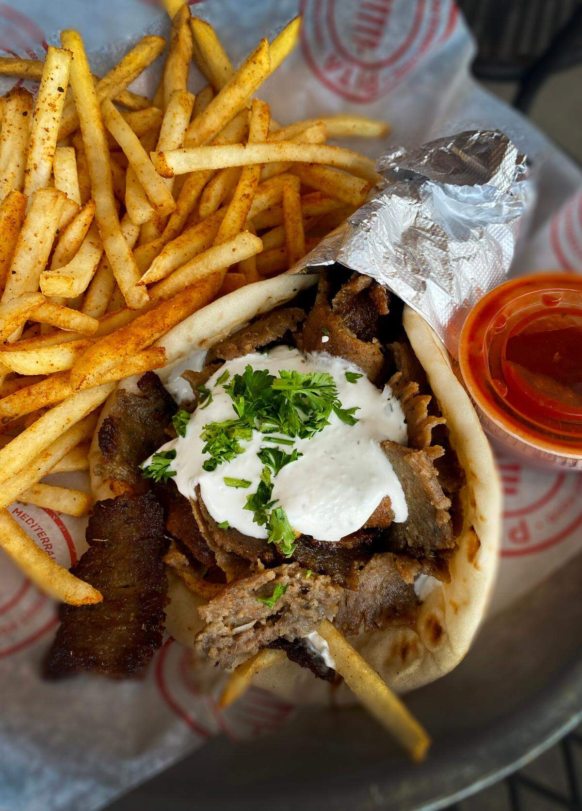 Ledger-Enquirer reporter Kelby Hutchison ordered the Signature Gyro with a side of fries from Pita Mediterranean Street Food at 6600 Whittlesey Blvd, Columbus, Georgia. 08/04/2023