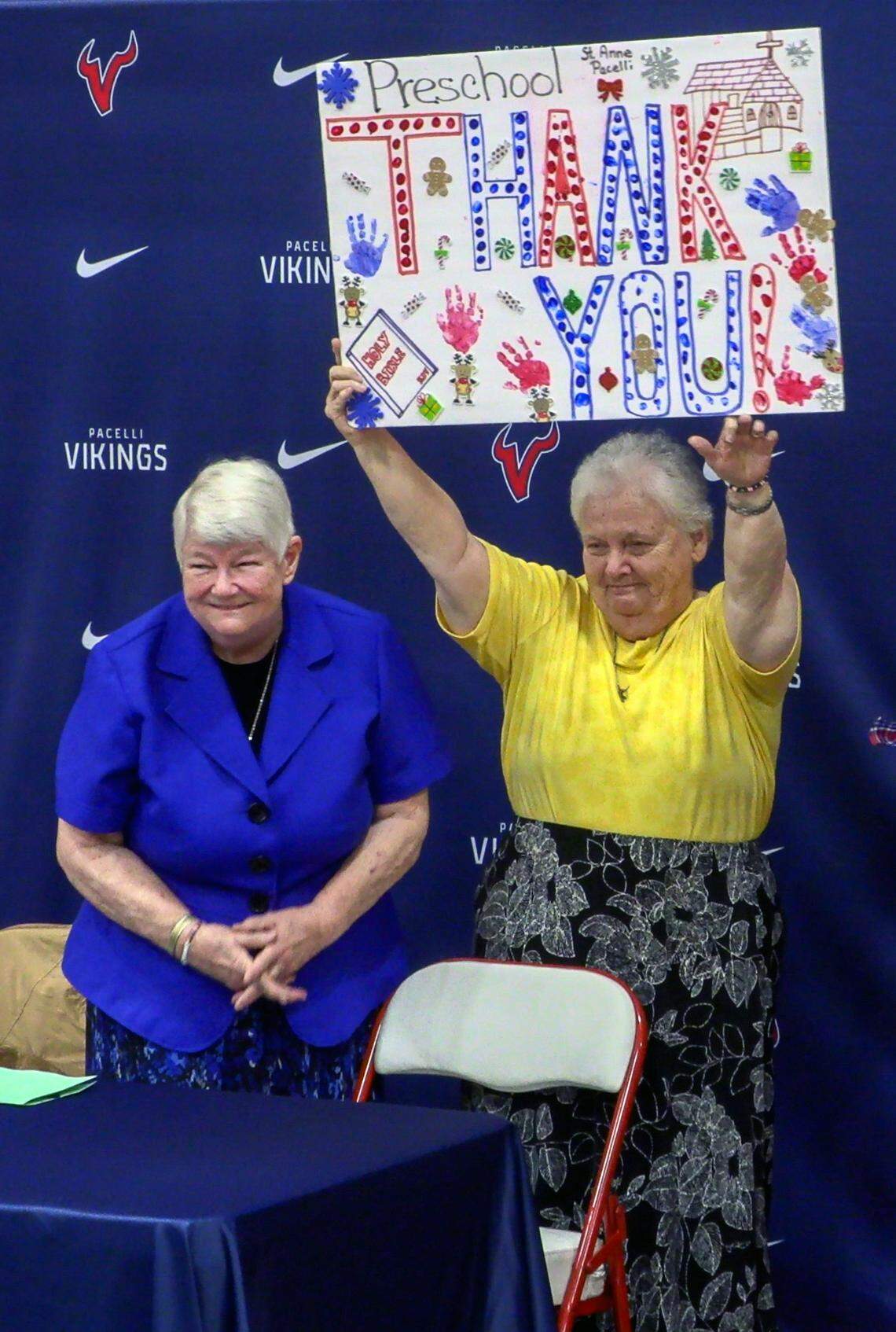 Sister Pat Thompson, left, and Sister Margaret Downing, both of the Sisters of Mercy, were recognized at St. Anne-Pacelli Catholic School on Dec. 9, 2024, with a ceremony honoring them. Both are retiring, and the school unveiled a special basketball jersey in their honor. 12/09/2024