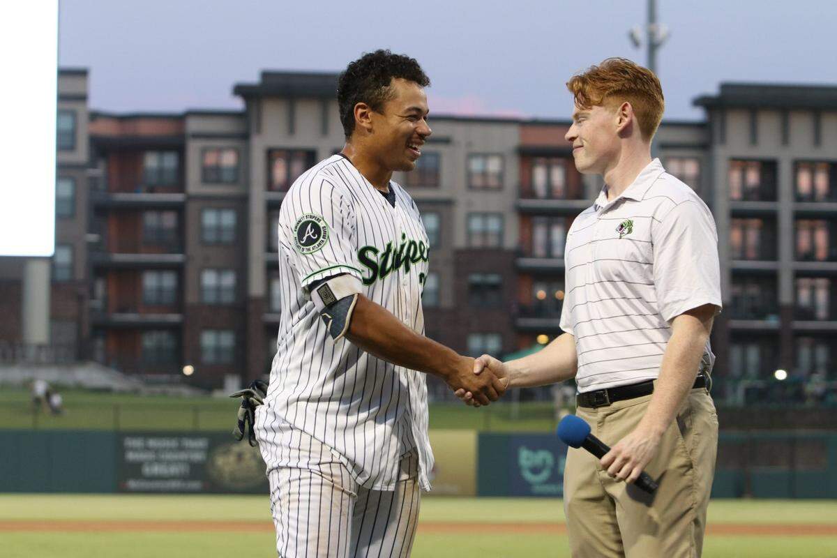 Jack Johnson meets with Drake Baldwin after a Gwinnett Stripers 2024 game at Coolray Field in Lawrenceville, Georgia. Johnson would interview a “Stripers Player of the Game” on the field after each home win. That day, Baldwin drew a walk-off walk fo the Atlanta Braves’ Class AAA affiliate. The Columbus Clingstones recently announced Johnson has been hired as the first lead broadcaster and play-by-play voice of the Atlanta Braves’ new Double-A franchise.
