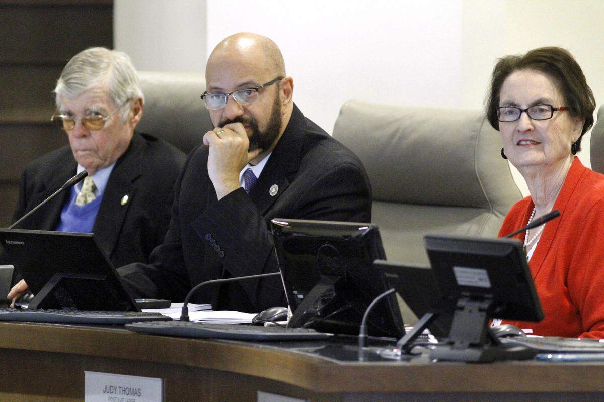 ROBIN TRIMARCHI rtrimarchi@ledger-enquirer.comColumbus city councilors Tom Buck, left, Bruce Huff and Judy Thomas listen to presentations during the city council meeting Tuesday at the Citizens Service Center. 02.09.16