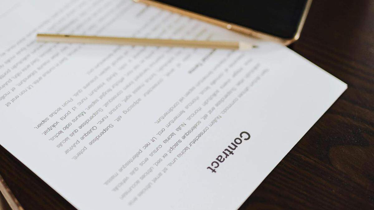  https://www.pexels.com/photo/close-up-of-paper-contract-on-table-in-office-4968569/