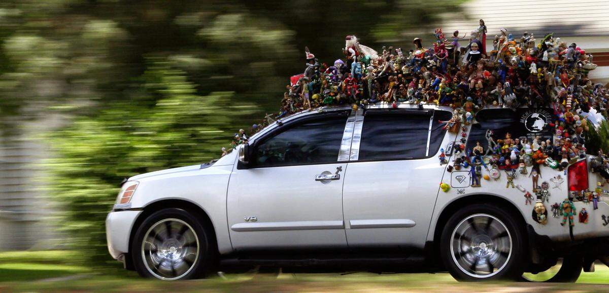 Columbus resident Michael Angelo Jackson, 61, has glued an assortment of superheroes, sports stars and fictional characters on top of and inside his 2008 Nissan Armada. He estimates that more than 1,100 figures are now stuck somewhere to his vehicle, and there’s room for more. 05/25/2021