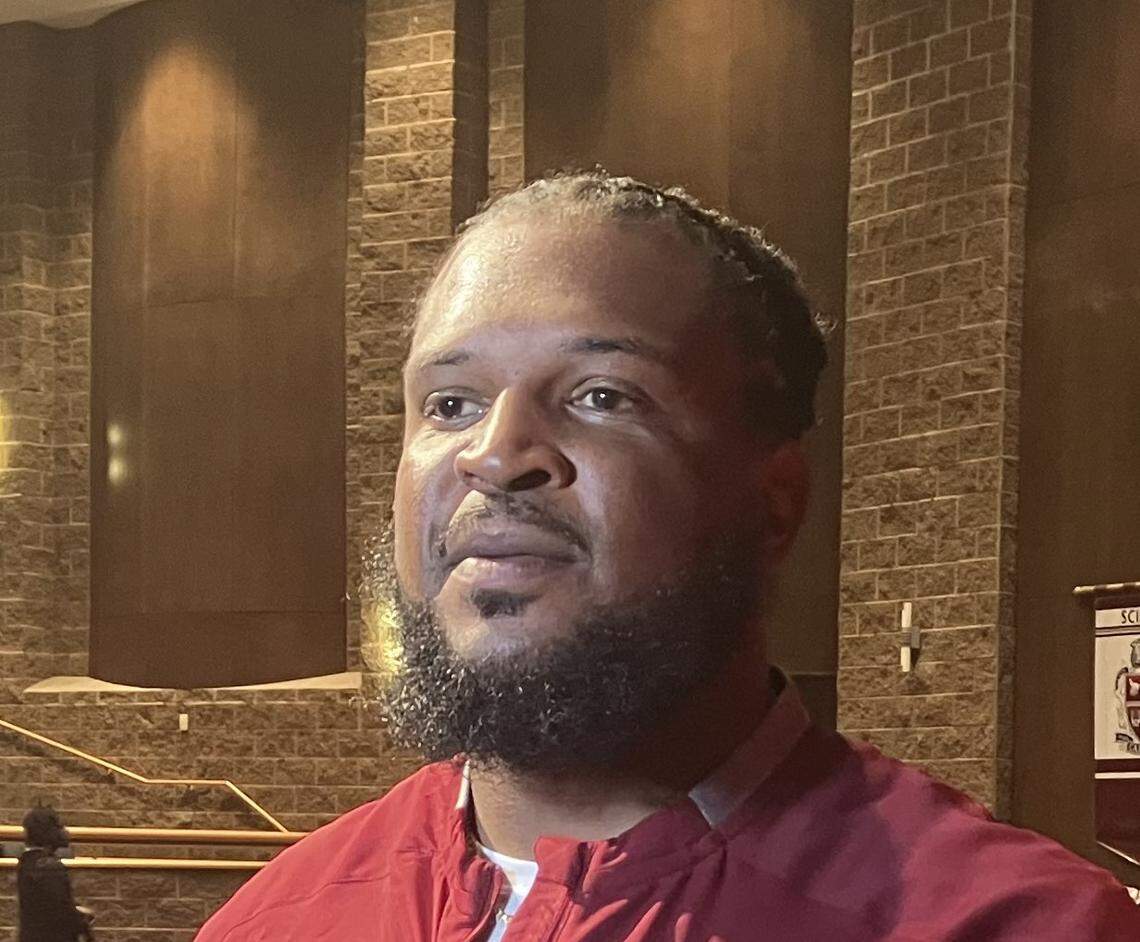 Jarvis Jones speaks to reporters May 25, 2025, in the Carver High School auditorium, where he was announced as the football program’s new head coach.