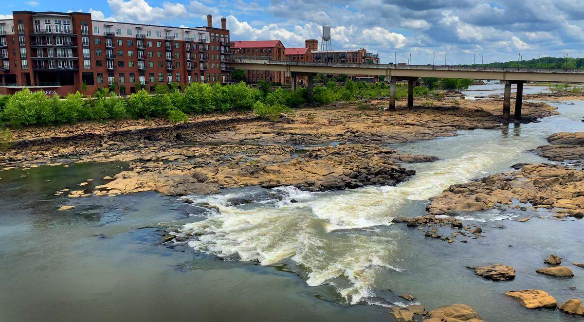 The Chattahoochee River, pictured here from atop a pedestrian bridge that spans the river and links Columbus, Georgia( background) with Phenix City, Alabama. 04/26/2022