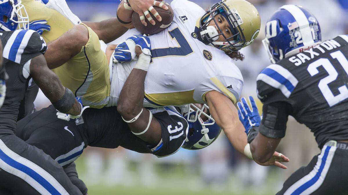 Georgia Tech's Patrick Skov (7) is brought down by Duke's Breon Borders after picking up a first down during the second half of an NCAA college football game, in Durham, N.C., Saturday, Sept. 26, 2015. Duke won 34-20. (AP Photo/Rob Brown)