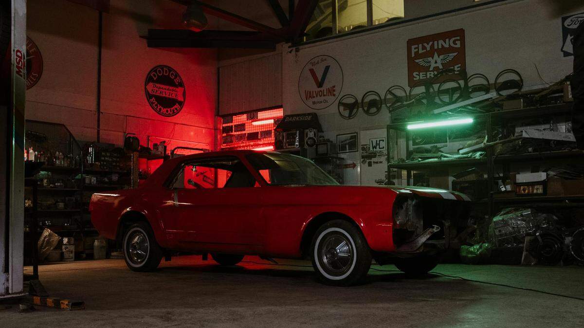 https://www.pexels.com/photo/red-vintage-car-parked-in-front-of-store-4488637/