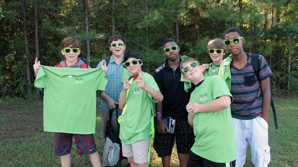 Callaway Middle School students donned bright green t-shirts and sunglasses in support of the cause to combat bullying "Step Up. Step In" (SUSI). Over 150 students heard the grant-funded program sponsored by the Georgia Department of Public Health, District 4. Other entities are also involved in implementing the campaign in a fun, innovative way throughout the three Troup County middle schools to help ensure the message spreads throughout the district. Various activities are planned to help promote the message about bullying. Pictured wearing their green shirts and glasses are, from left, Wesley Marchman, Christian Moon, Austin Ozley, KeOnthony Seals, Tyson Haar, Dawson Wright and Treyveon Reeves.