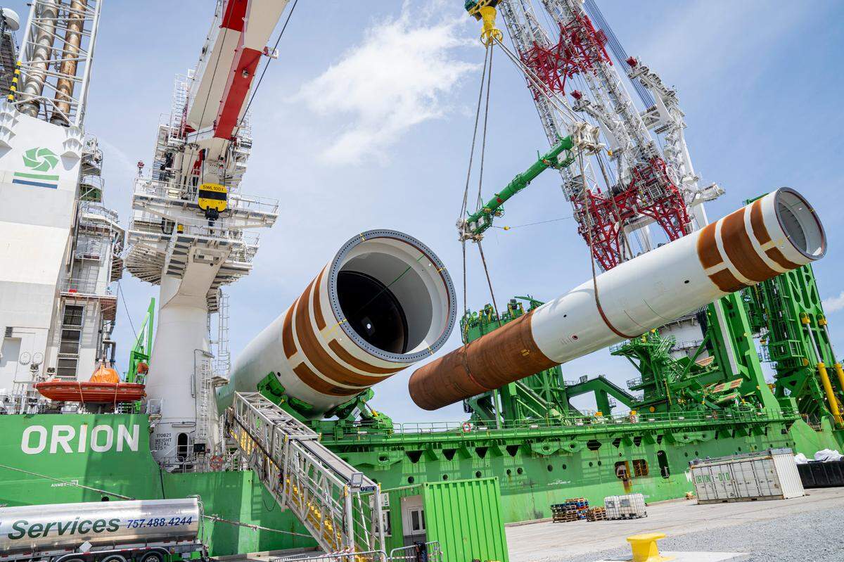Monopile foundations for Dominion Energy’s Coastal Virginia Offshore Wind (CVOW) project are loaded onto an installation vessel in Portsmouth, Va. 5/9/2024