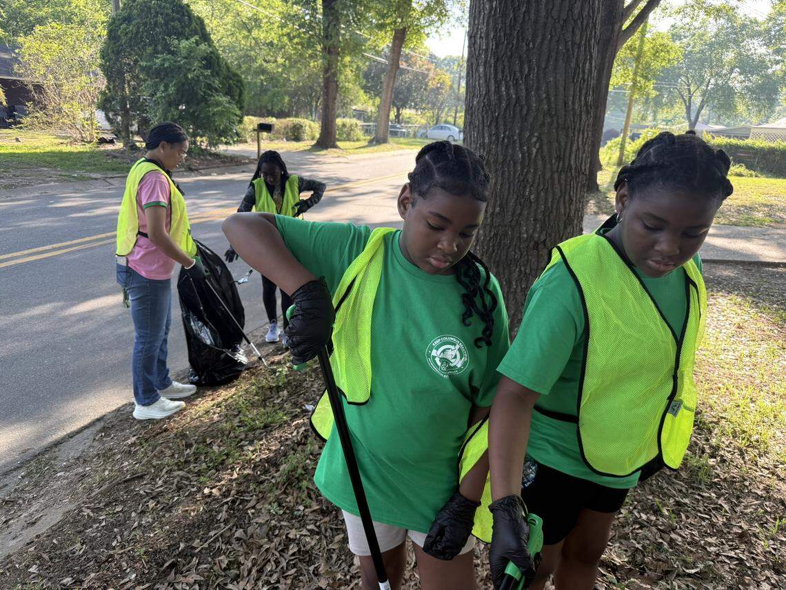 Some of the participants in the Keep Columbus Beautiful 2025 Earth Day events pick up trash.