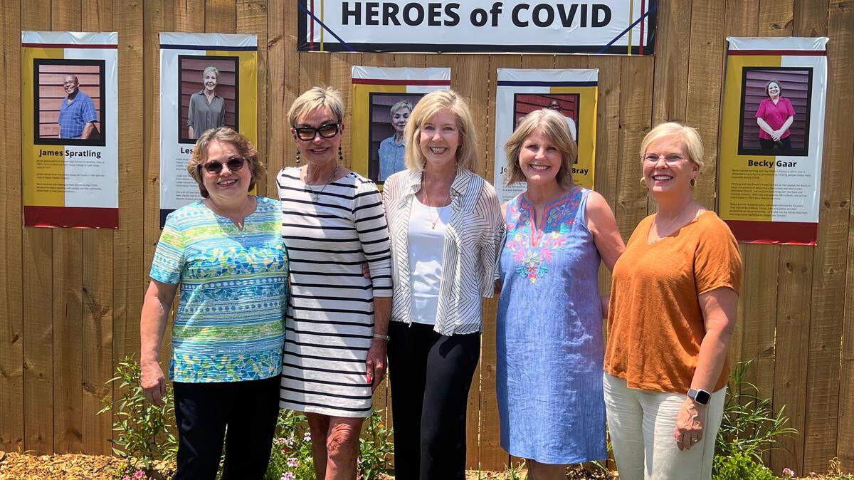 Volunteers for the Pastor’s Pantry at First United Methodist Church stand in front of the Chipley Historical Center’s new garden exhibit honoring Pine Mountain, Georgia heroes who combated food insecurity during the coronavirus pandemic.