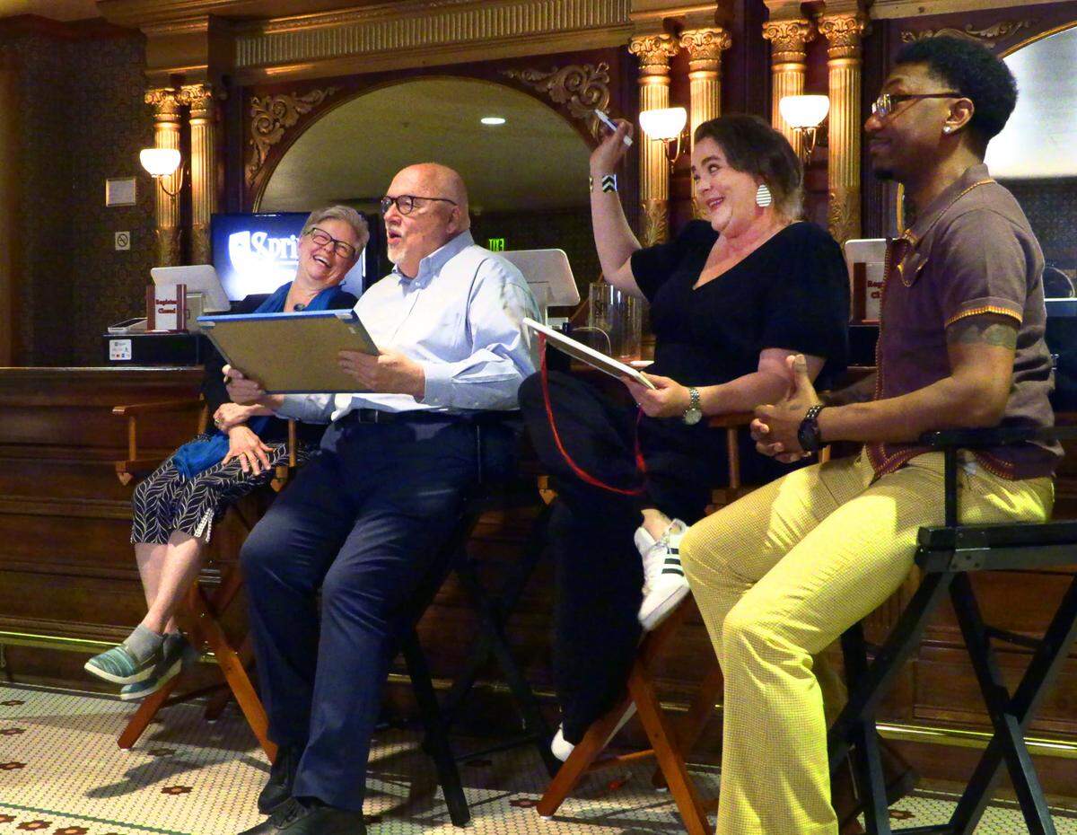 Debbie Anderson, far left, joins Paul Pierce, Danielle Patterson Varner, and Keith McCoy in a game of trivia at the “Springer Unplugged” event on Friday, April 26, 2024. Anderson is retiring as the Springer’s musical director. 04/26/2024