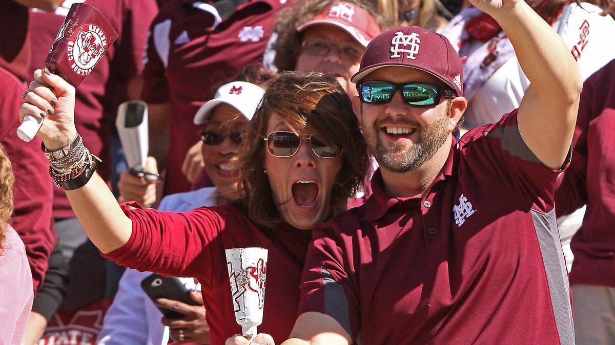 JIM LYTLE/Associated PressIn this file photo from Oct. 4, 2014, Mississippi State fans Crystal and Drew Thomas of Ackerman, Miss., celebrate an MSU touchdown by ringing their cowbells during the second half against Texas A&M in Starkville, Miss.