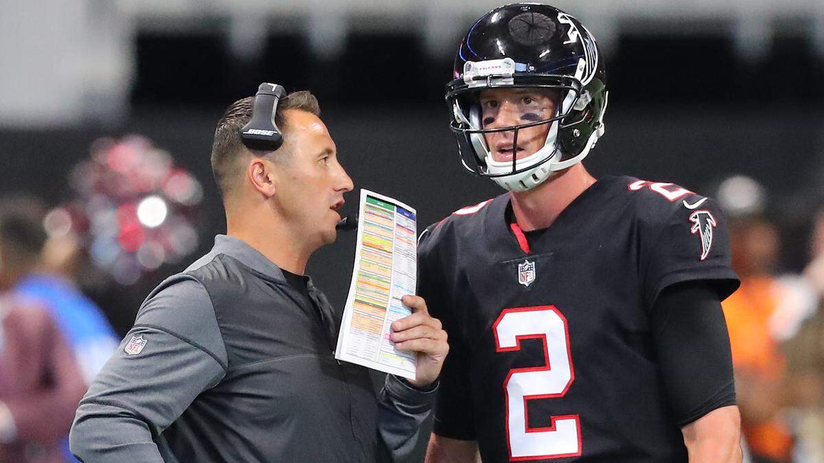 Atlanta Falcons offensive coordinator Steve Sarkisian confers with quarterback Matt Ryan during a time out in the second half against the Buffalo Bills on Sunday, Oct. 1, 2017, in Atlanta, Ga.