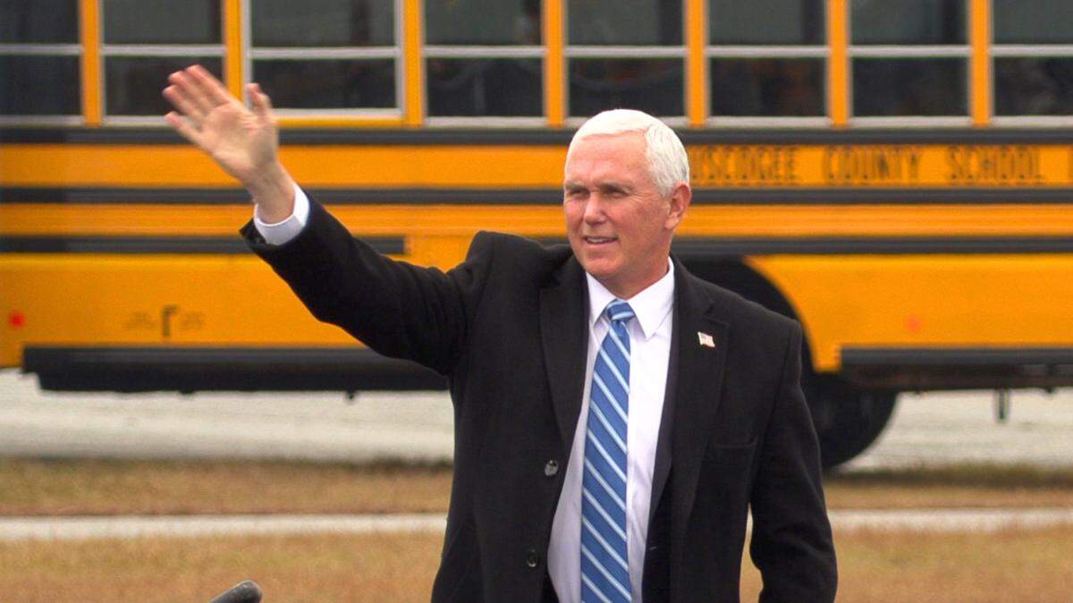 Vice President Mike Pence greets people gathered at the Columbus airport in this 2020 file photo. Pence is supporting Gov. Brian Kemp against Donald Trump-backed candidate David Perdue.