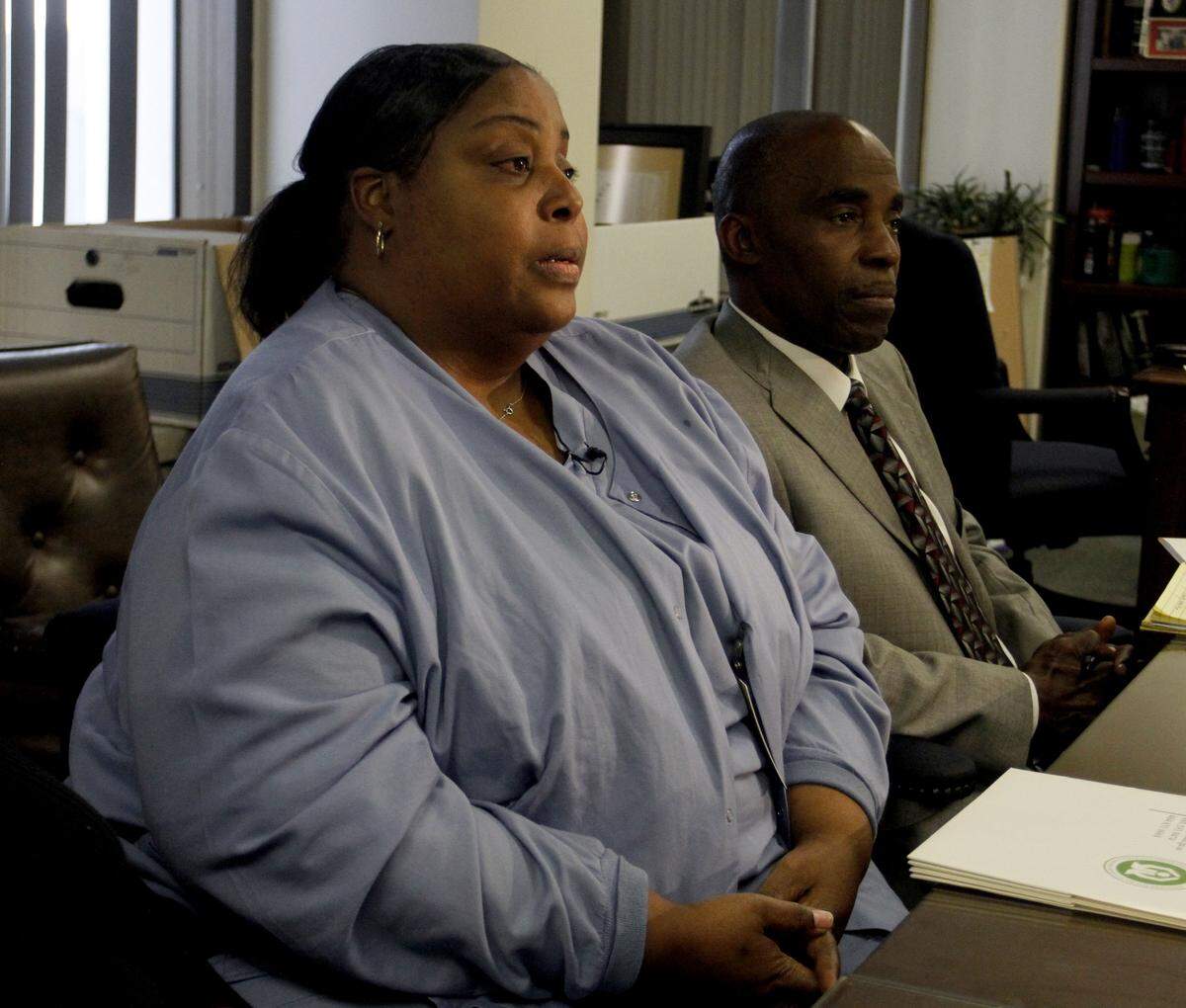Joe Paull jpaull@ledger-enquirer.com Judy Grimes, mother of murder victim Calvin Grimes, speaks to the media while sitting next to Chief District Attorney Al Whitaker Tuesday afternoon.