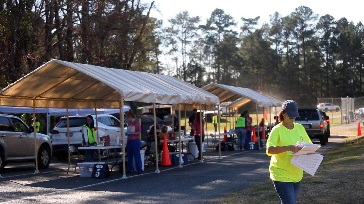 MCSD risk management director Tracy Fox coordinates on-site logistics during Muscogee County School District’s vaccine clinic for employees, dispensing Johnson & Johnson doses on Thursday, March 11, 2021, in Columbus, Ga.