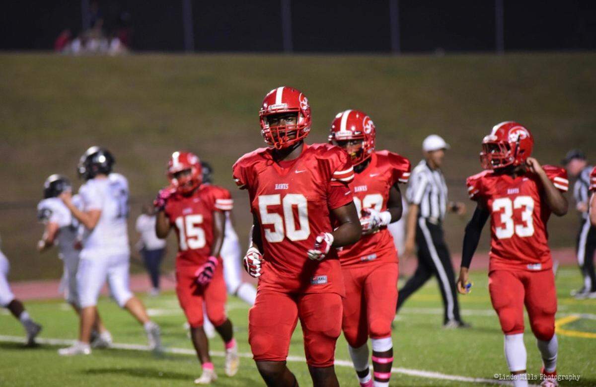 Hardaway defensive end Mykel Williams (No. 50) jogs off the field during a high school football game in 2020.