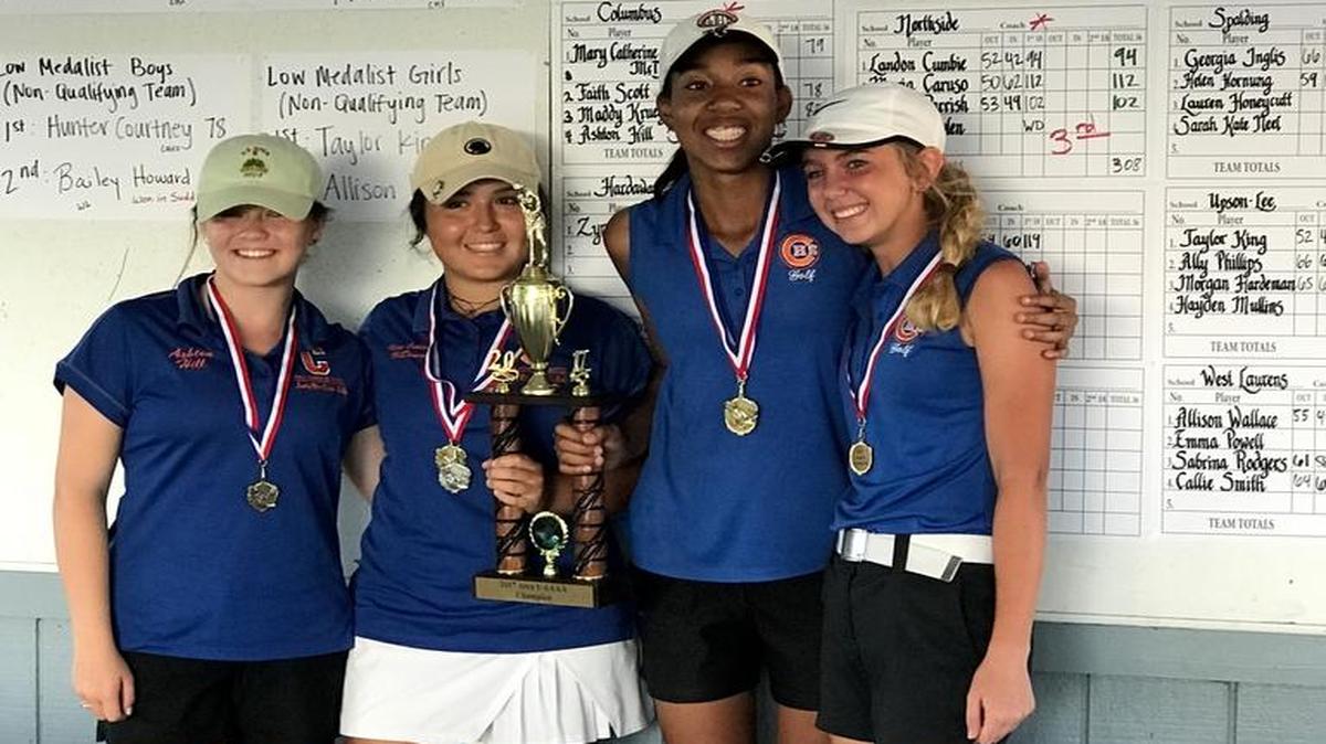 The Columbus girls golf team celebrates its area tournament title on Monday, May 1, 2017.