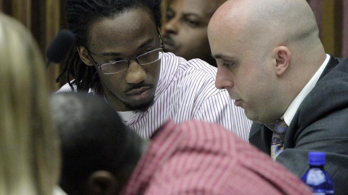 Dontevious Doleman, left, talks with his attorney Will Kirby in Superior Court Friday.