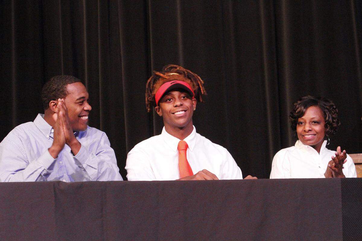 Harris County running back Tae Crowder signs his letter of intent to play for the University of Georgia during National Day ceremonies on Feb. 4, 2015.