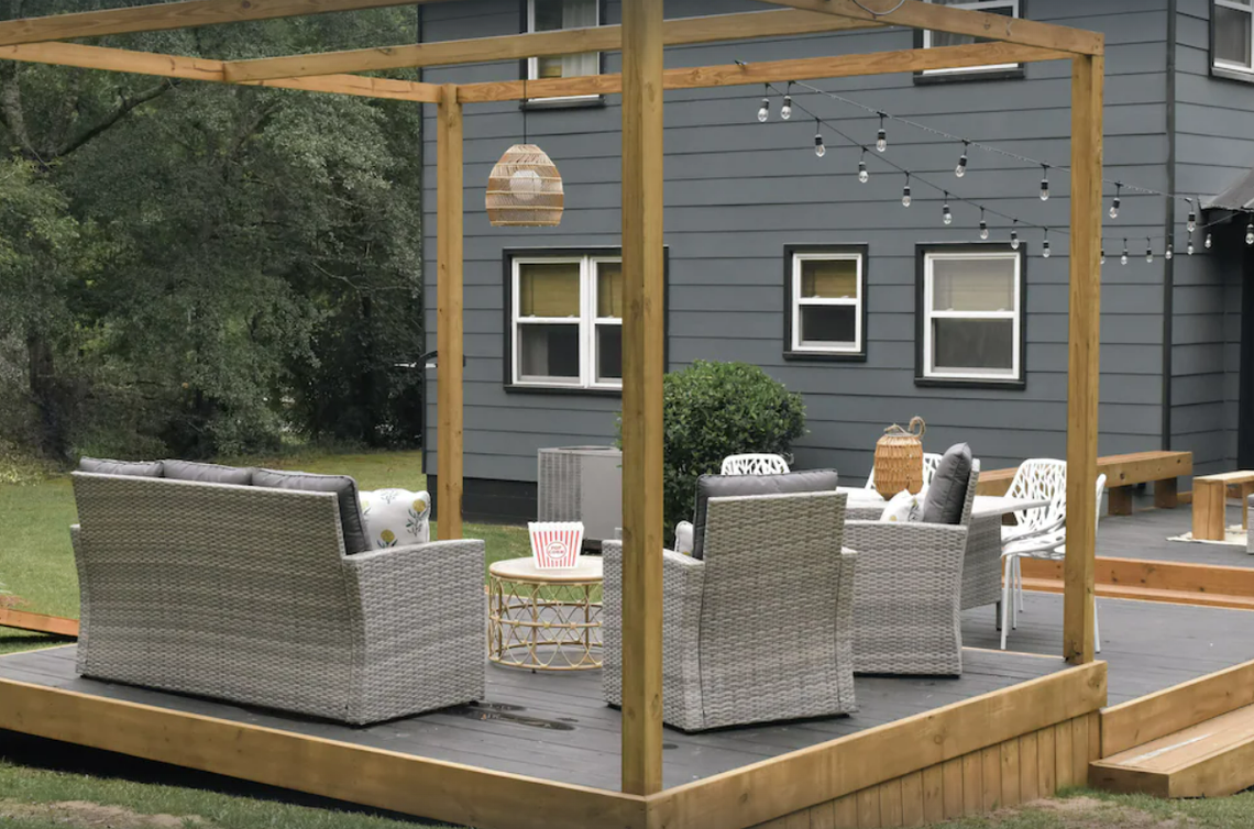 The lounge area has a sofa, chairs and lights strung around for those late night movie viewings.