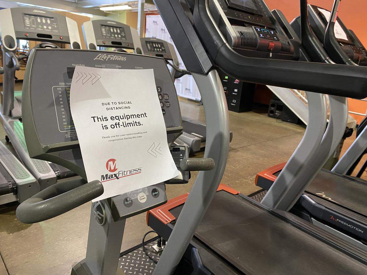 Cardio machines at Max Fitness Elite gym on Tower Road in Columbus are marked off so that patrons can practice social distancing while working out.