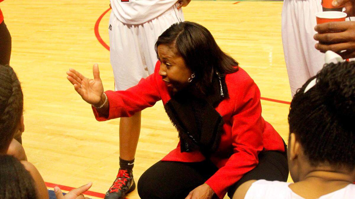 Central coach Carolyn Wright talks to the team during a timeout in the Class 6A semi-final game of the AHSAA Final Four in Birmingham, AL.