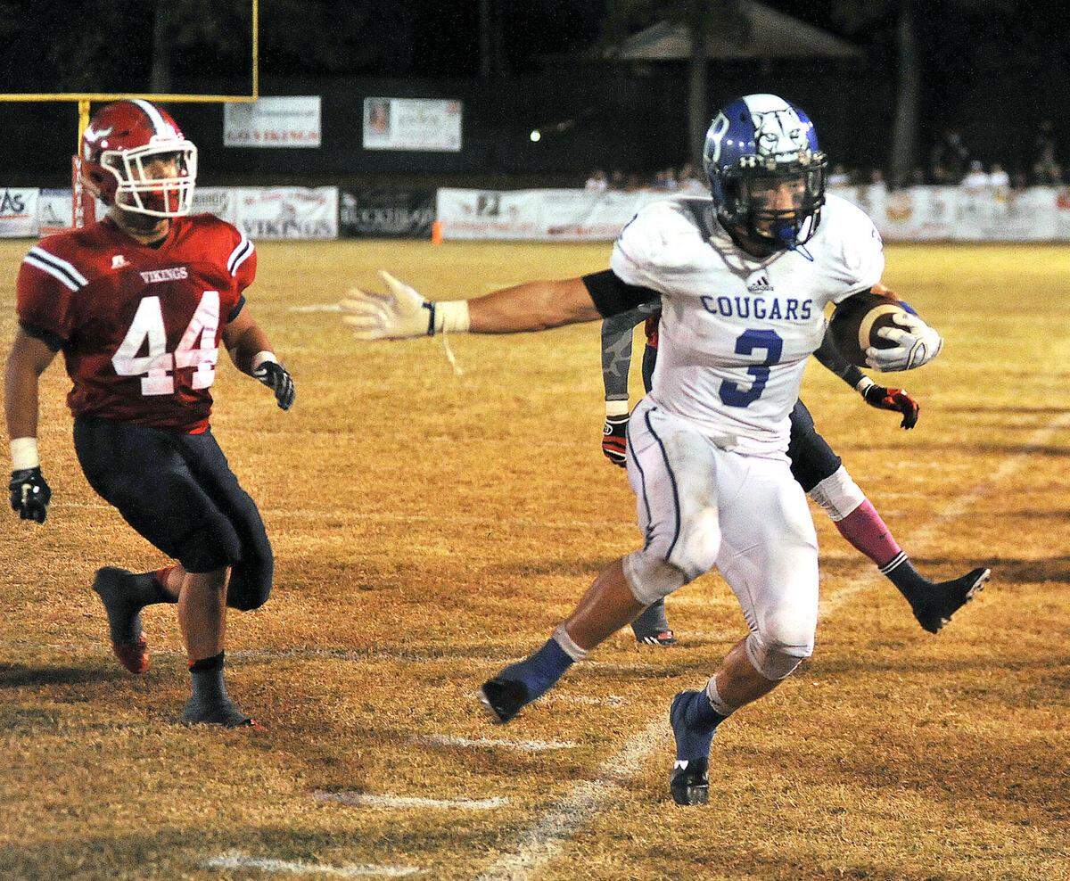 Brookstone's Prather Hudson is forced the side lines by Pacelli's Michael Herrera and Ricket Carter