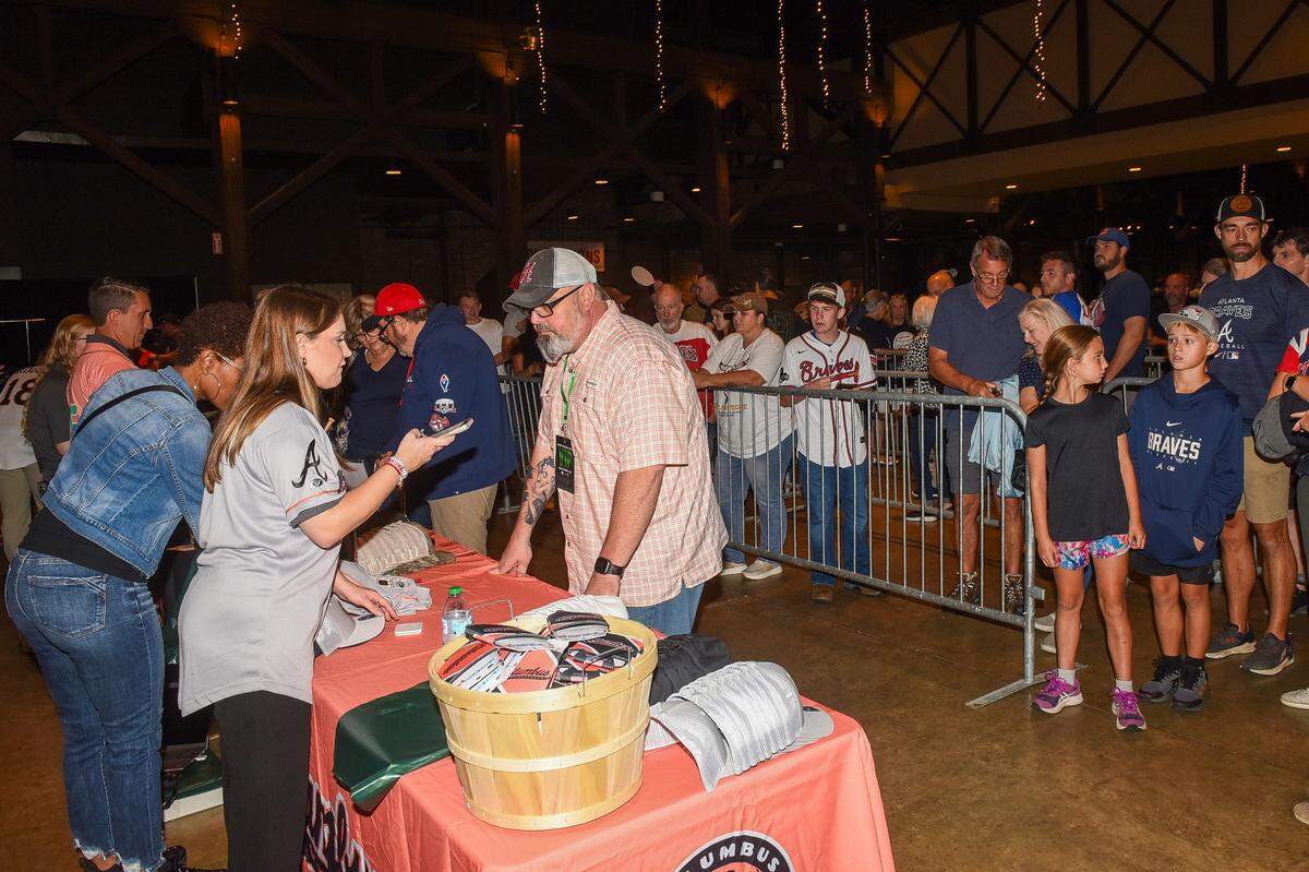 Fans line up Sept. 6, 2024, to buy Columbus Clingstones merchandise after the Atlanta Braves Double-A minor league baseball team’s name was announced during the Uptown Columbus Friday Night Concert in the Columbus Convention and Trade Center.