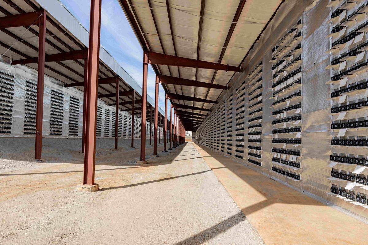 Fans blow on the outside of the Sandersville crypto mine operation, owned by CleanSpark. 