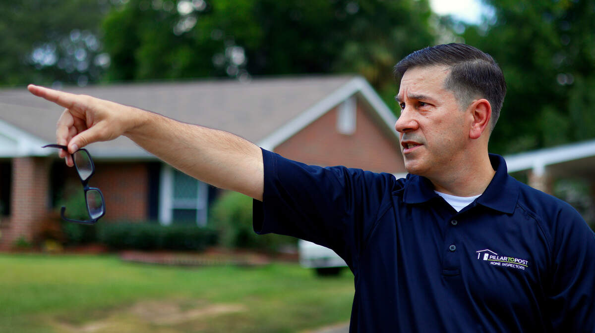 Ben York, a home inspector with Pillar to Post Home Inspectors, inspects a home in Columbus’ Oakland Park neighborhood.