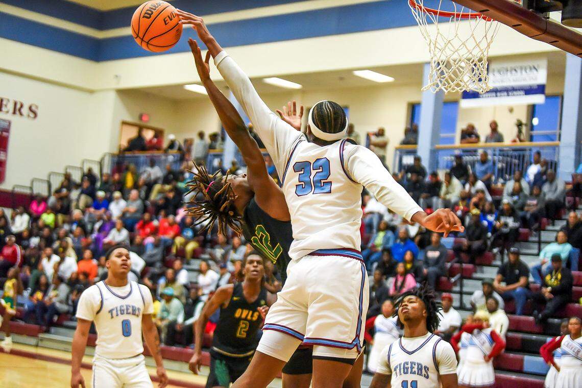 Spencer High School’s Demarcus Horne’s has his shot blocked by Carver’s Tobiaz Tolbert during the Georgia High School Association Class AA boys basketball state quarterfinals Feb. 26, 2025, at Carver.
