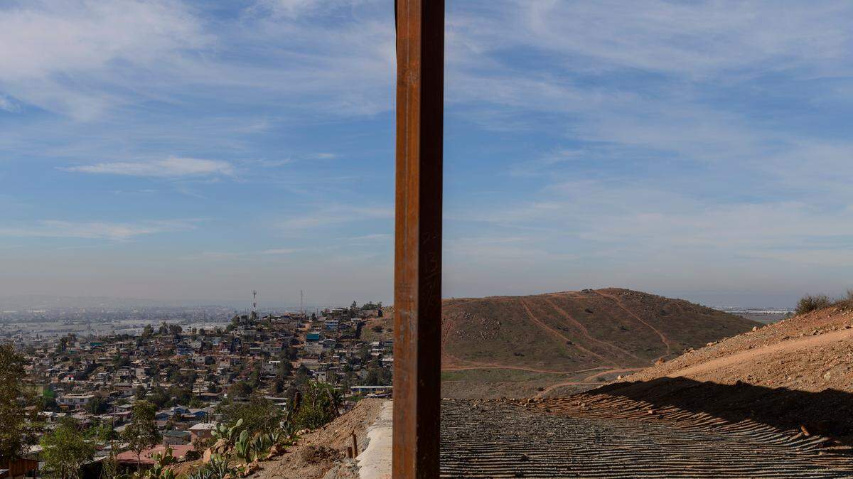 This 2018 file photo shows Tijuana, Mexico, left, and San Diego, Calif., separated by a U.S. border fence.