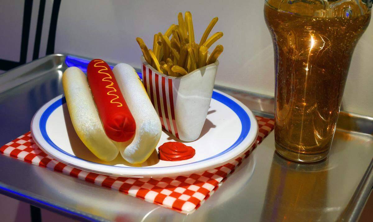 The Columbus Museum is bringing classic Americana to local art lovers. “Daily Special, The Art of John Miller” is a celebration of American diner culture and an ode to classic American cars. Opening Tuesday, Aug. 12, and running through Jan. 4, 2026, the retro, diner-inspired installation serves up classic American cuisine with hamburgers, hotdogs, french fries, sodas, and donuts, all sculpted from glass. 08/08/2025