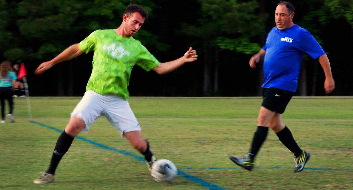 Jacob Crumbley, left, plays in an adult league soccer game recently at Woodruff Farm Soccer Complex in Columbus, Georgia.